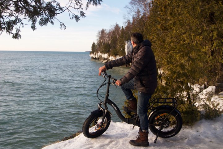 a man riding a motorcycle in the water